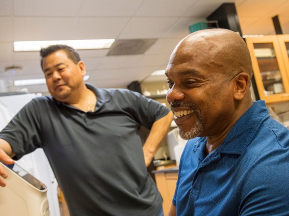 Mark A. Nelson, PhD (right), works with research scientist Marc Oshiro, PhD, who performs DNA amplification in a Thomas D. Boyer Liver Institute laboratory.
