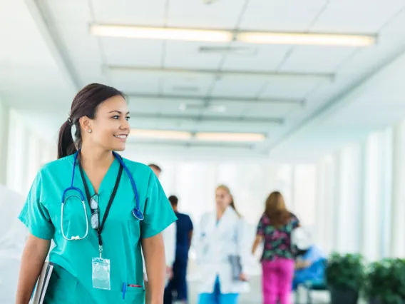 nurse walking down a hallway