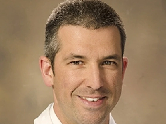Travis Dumont, MD