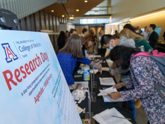 [Attendees, presenters and panelists sign-in April 2 for the University of Arizona College of Medicine – Tucson Research Day 2025 activities at the HSIB Forum at the U of A Health Sciences Tucson campus.]