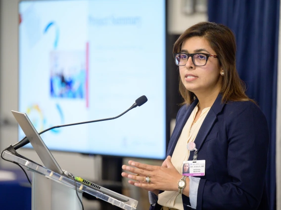 [LAMS Fellowship graduate Saher Khalid, MD, an internist in the Division of General Internal Medicine, Geriatrics & Palliative Medicine, presents on her leadership project at the Sparking Change Celebration on May 6, 2025.]