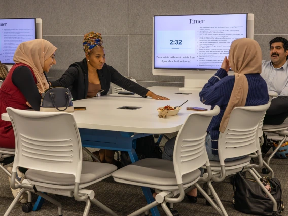 [Saman Nematollhi, MD (right), laughs at comments by Monica Hinestroza Jordan, MD (center), who talks about going to medical school in Pereira, Colombia, her hometown, and working with a mobile health unit of the Colombian Red Cross before coming to the USA for her residency and fellowship training. ]