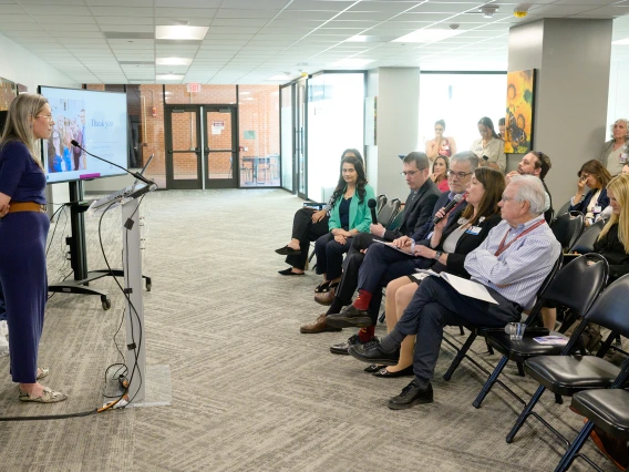 [Amy Klein, MD, listens to a question from Alison Flynn-Gaffney, CEO of Banner – University Medical Center Tucson and South, in the front row with BUMG CEO David Orlandi, MD, MBA, and the PACCS division’s Gordon Carr, MD, CMO at Banner – UMC Tucson, to her right.]