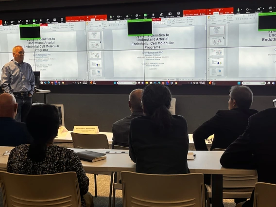 [Luke Szweda, PhD, answers a question from Hossein Ardehali, MD, PhD, about his presentation on genetics in arterial cell molecular processes during the Cardiovascular Health Breakout Session. Both are Division of Cardiology faculty and Sarver Heart Center members.]
