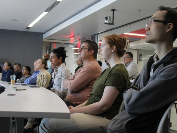 [Audience members, including DOM biostatistician Maryam Emami, PhD (fourth from right), listen to Luke Szweda, PhD’s presentation: “Daily rhythms in cardiac metabolism and the impact on diagnosis and treatment of heart disease.”]