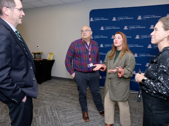 [DOM Interventional Pulmonology director Billie Bixby, MD (right center), shares a lighter moment with PACCS’ Gordon Carr, MD, CMO for Banner – University Medical Center Tucson, and James Knepler, MD, and Stephanie Worrell, MD, Thoracic Surgery Section chief in the Department of Surgery and colleague on the U of A Cancer Center’s lung cancer clinical research team.]