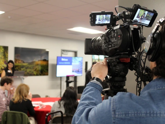 [A UAHS BioCommunications videographer records the New Faculty Retreat for archiving for later viewing.]