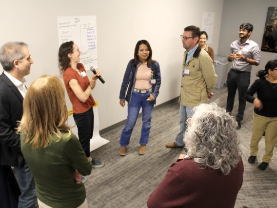 [Splitting up after Dr. Fain’s address into four groups of preferred communication styles, Anna Morenz, MD, MPH, has a laugh as she talks about what the “dominance” group is like.]