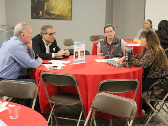 [Amy Sussman, MD (on right), and Laura Meinke, MD, DOM vice chair and associate vice chair of education, talk with Hossein Ardehali, MD, PhD, and Luke Szweda, PhD, two new Division of Cardiology faculty members.]