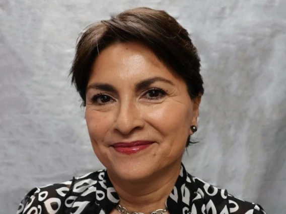 [Mary E. Bonarand - brunette woman in black and white patterned blouse]