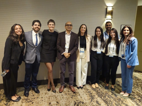 [Bujji Ainapurapu, MD, FACP (center), assistant professor, Inpatient Medicine division, and IM Residency Program – Tucson associate program director, with (from left) fourth-year medical student Gisselle Pegaitaz, and PGY2 IM residents: Eduardo Garcia Licerio, MD; Jessica Kitsen, DO; Emily Tishkoff, MD; Kellie Jeong, DO; Dwani Patel, MD, PhD; Tammy Zamaitis, DO, and Shenar Dinkha, DO.]