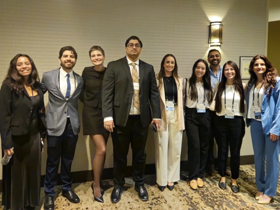 [A lecturer at the 2025 ACP Arizona Chapter Scientific Meeting, Madhav Chopra, MD (center), assistant professor, Pulmonary division, and Interventional Pulmonology Team member with (from left) fourth-year medical student Gisselle Pegaitaz, and PGY2 IM residents: Eduardo Garcia Licerio, MD; Jessica Kitsen, DO; Emily Tishkoff, MD; Kellie Jeong, DO; Dwani Patel, MD, PhD; Tammy Zamaitis, DO, and Shenar Dinkha, DO.]