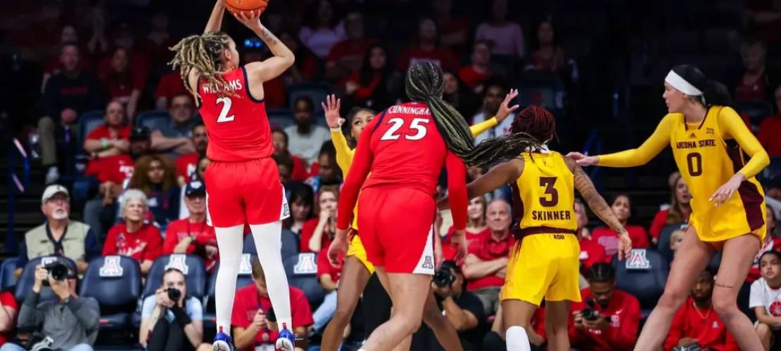 U of A’s Jada Williams (#2), who finished with 18 points, leaps into the air to shoot a basket.