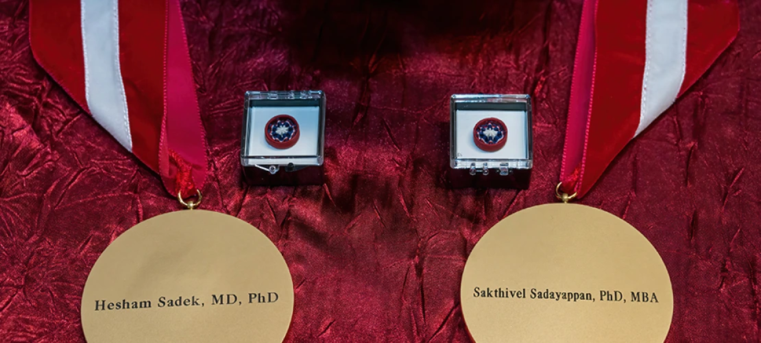 Medallions that accompany an investiture, here emblazoned with the names of Drs. Hesham Sadek and Sakthivel Sadayappan.