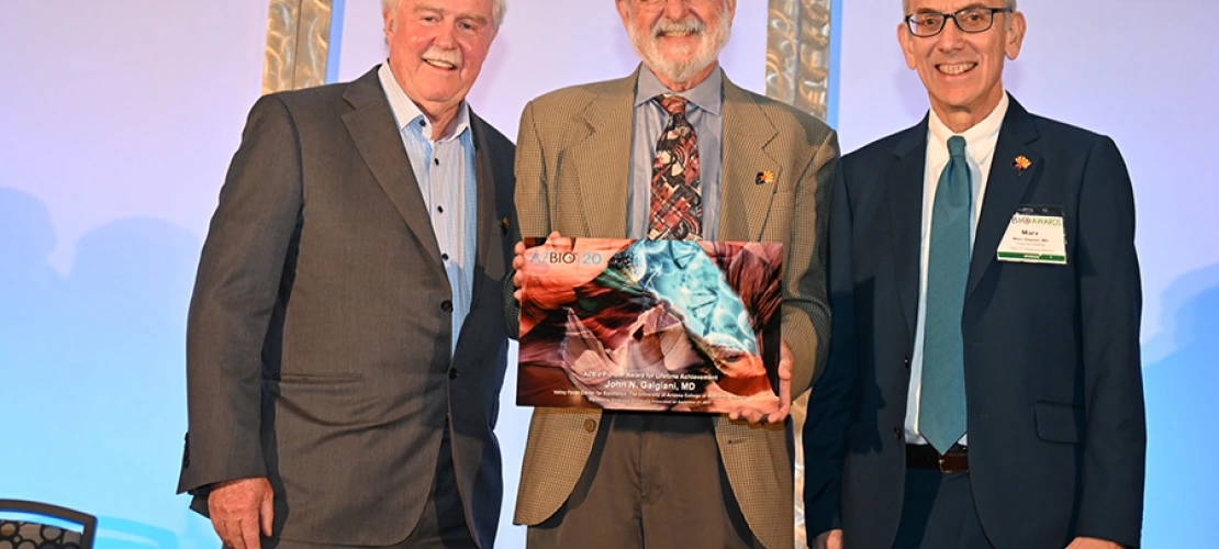 Tom Grogan, MD, a UArizona Pathology professor emeritus and Ventana Medical Systems founder, John Galgiani, MD, founder of the Valley Fever Center for Excellence (holding AZBio Pioneer Award), and the Sarver Heart Center’s Marvin Slepian, MD, pose for a photo. Both Drs. Grogan and Slepian are prior winners of the award.