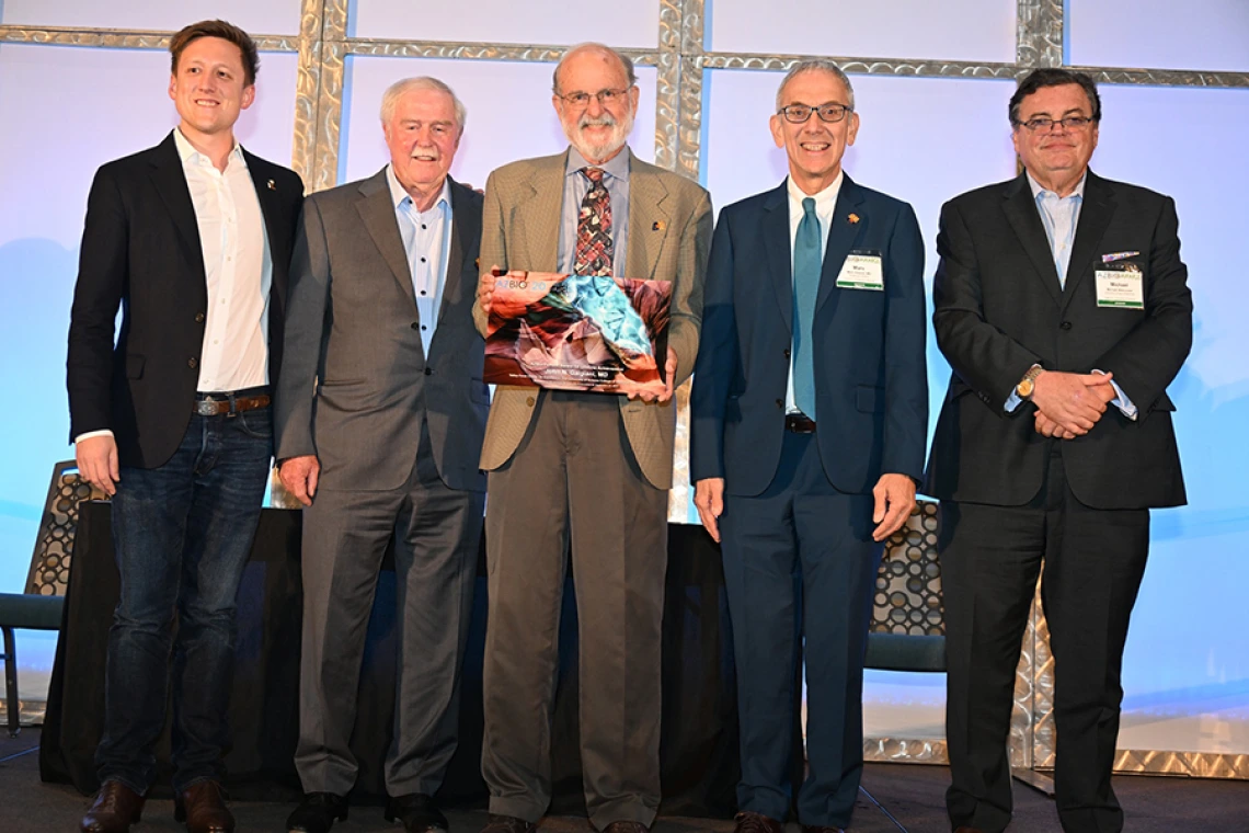 Pictured are Dylan Balsz, CEO of Anivive, the company developing a cocci vaccine for dogs and possibly humans; UA Pathology’s and Ventana Medical’s Dr. Tom Grogan; Dr. Galgiani (holding Pioneer Award); Dr. Marvin Slepian, of the UArizona Division of Cardiology, Sarver Heart Center and Arizona Center for Accelerated Biomedical Innovation; and Michael M. I. Abecassis, MD, MBA, dean of the UArizona College of Medicine – Tucson. Both Drs. Grogan and Slepian are past Pioneer Award winners.