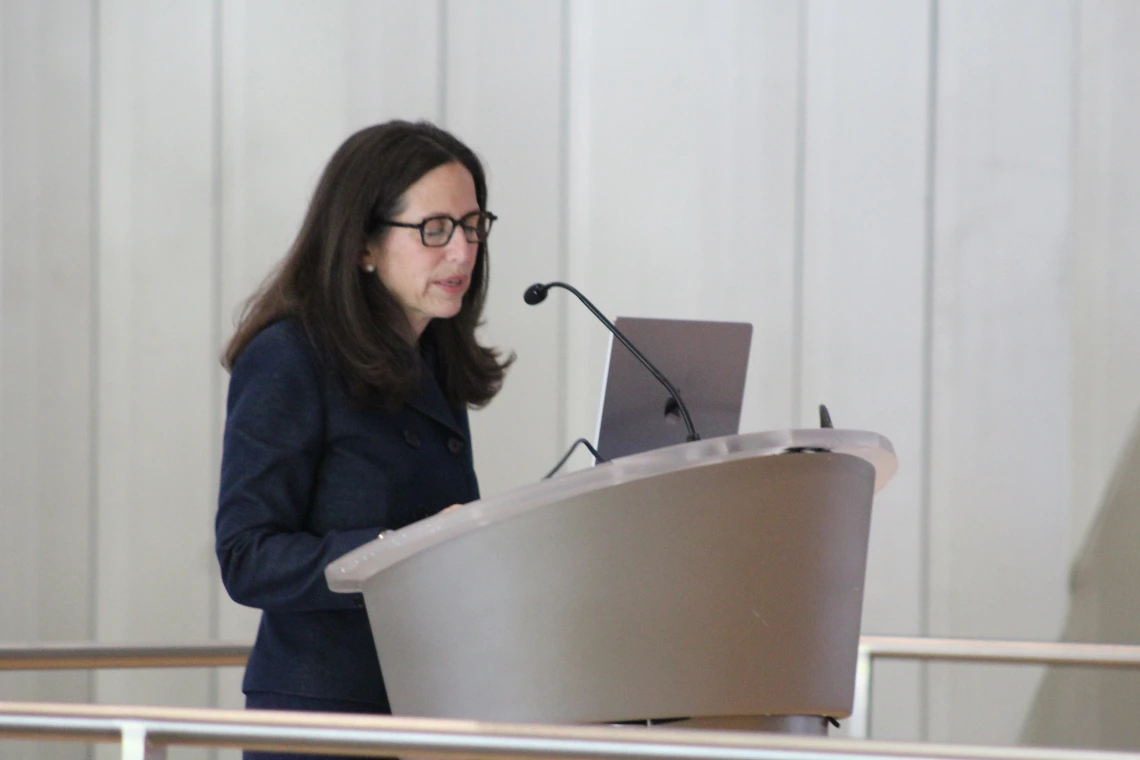 [Second keynote speaker Jacqueline Jeruss, MD, PhD, a University of Michigan professor of surgery, addresses the audience in the HSIB Forum. Her talk was on, “Caring for breast cancer patients from bench to bedside.”]
