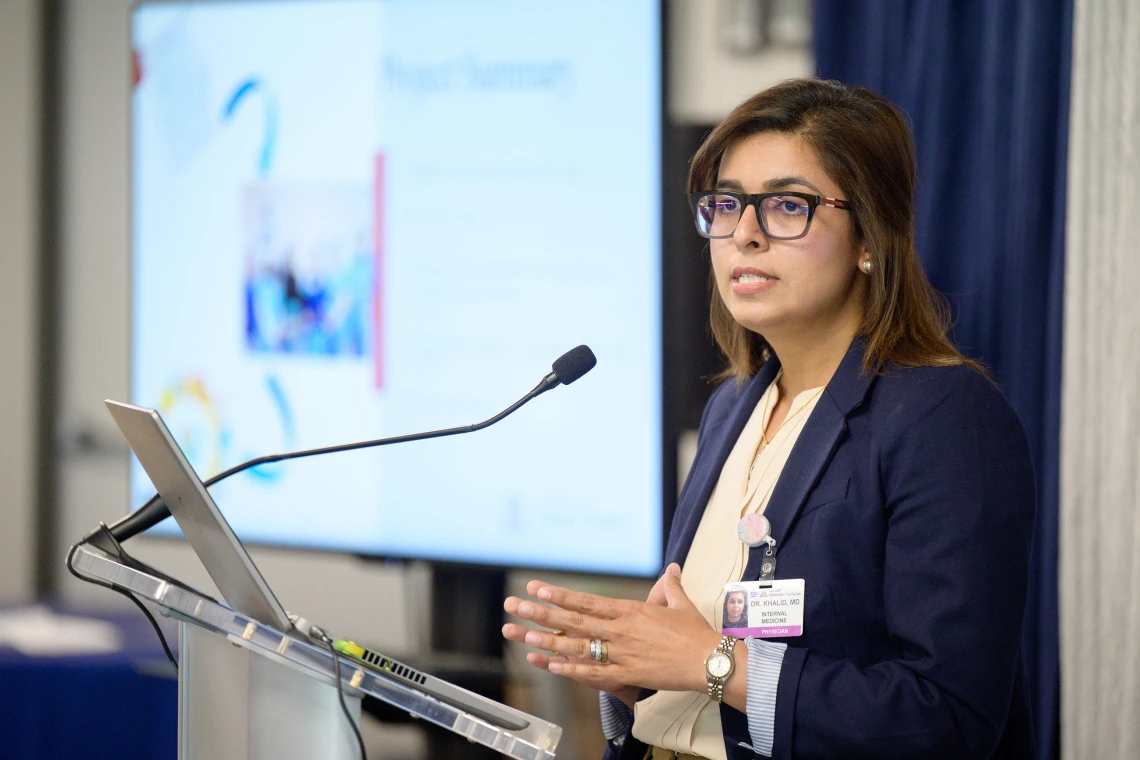 [LAMS Fellowship graduate Saher Khalid, MD, an internist in the Division of General Internal Medicine, Geriatrics & Palliative Medicine, presents on her leadership project at the Sparking Change Celebration on May 6, 2025.]