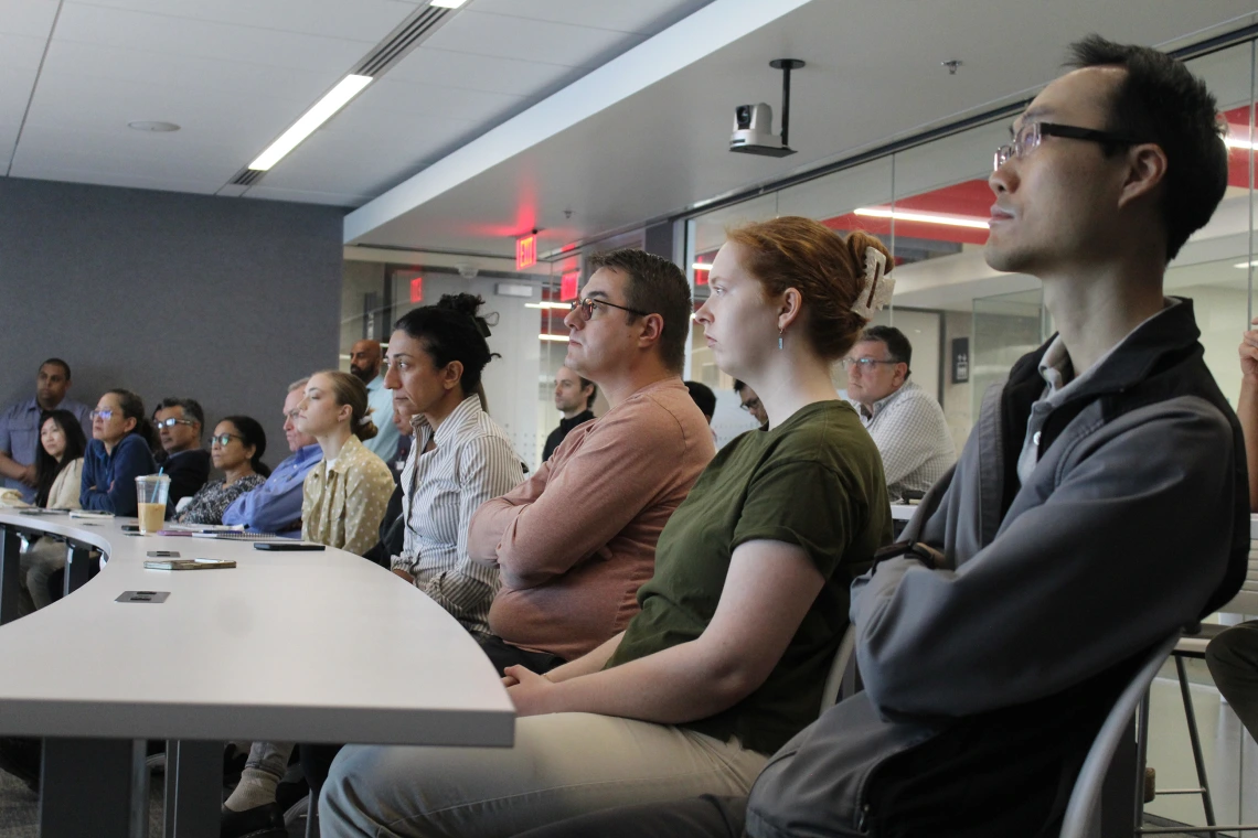 [Audience members, including DOM biostatistician Maryam Emami, PhD (fourth from right), listen to Luke Szweda, PhD’s presentation: “Daily rhythms in cardiac metabolism and the impact on diagnosis and treatment of heart disease.”]