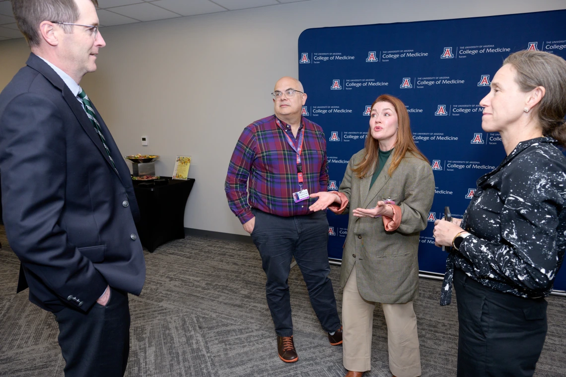 [DOM Interventional Pulmonology director Billie Bixby, MD (right center), shares a lighter moment with PACCS’ Gordon Carr, MD, CMO for Banner – University Medical Center Tucson, and James Knepler, MD, and Stephanie Worrell, MD, Thoracic Surgery Section chief in the Department of Surgery and colleague on the U of A Cancer Center’s lung cancer clinical research team.]