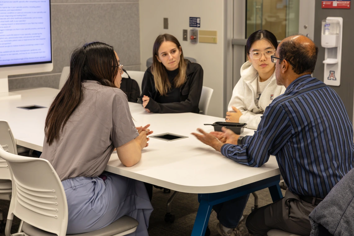 [IM Student Association members ask Puneet Shroff, MD, about his varied interests in medicine. He also completed an integrative medicine fellowship at the U of A and is a member of the college’s student-run Docapella a cappella singing group.]