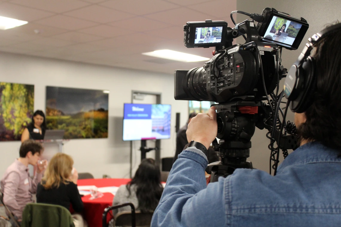 [A UAHS BioCommunications videographer records the New Faculty Retreat for archiving for later viewing.]
