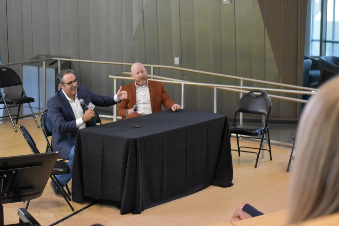 [CTDW co-leader Jarrod Mosier, MD (left), with Franz Rischard, DO (right), answers a question from Corey Casper, MD, Banner Research chief, on how the U of A Health Sciences colleges and their centers and institutes work together to bring the latest experimental therapies to patients via clinical trials – and the intricacies and detail that requires.]