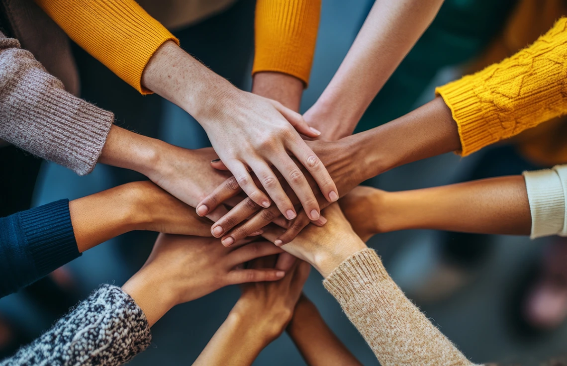 hands all together in collaboration