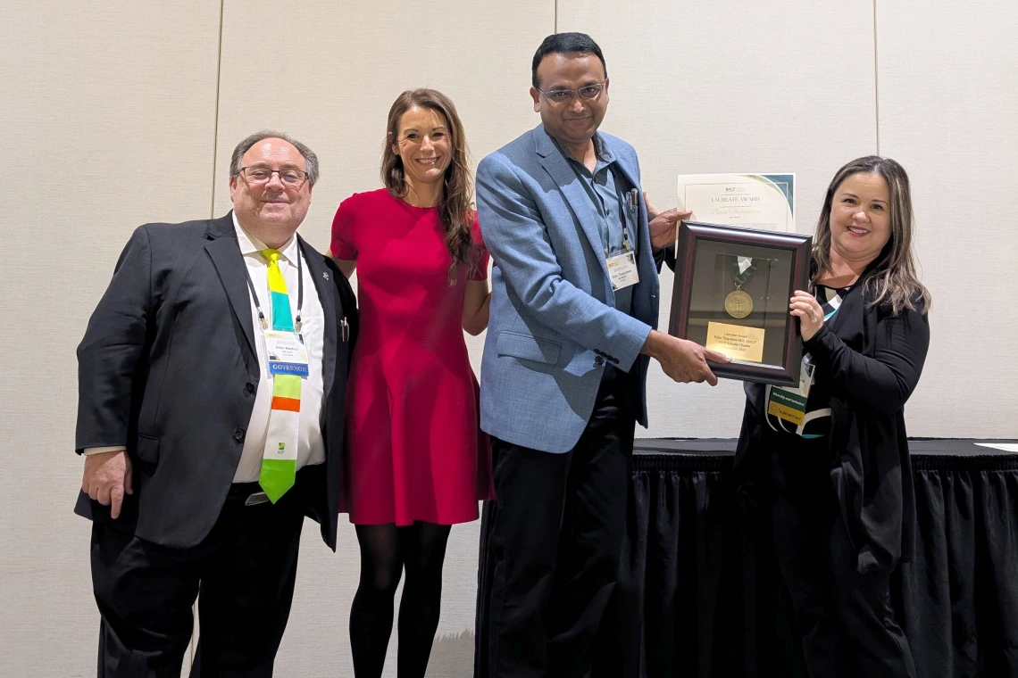 [2025 Laureate of the Year award winner Bijin Thajudeen, MD, FACP, MACP, FASN (2nd from right), DOM vice chair for community engagement and partnerships, and Division of Nephrology inpatient nephrology and dialysis unit services medical director and clinical research and outcomes associate director, with (from left) ACP Arizona Chapter governor Allan Markus, MD, MS, MBA, FACP, 2025 ACP-AZ Scientific Meeting chair Krystal Renszel, DO FACP; and the DOM’s Joy Bulger-Beck, MD, ACP-AZ Awards Committee chair.]
