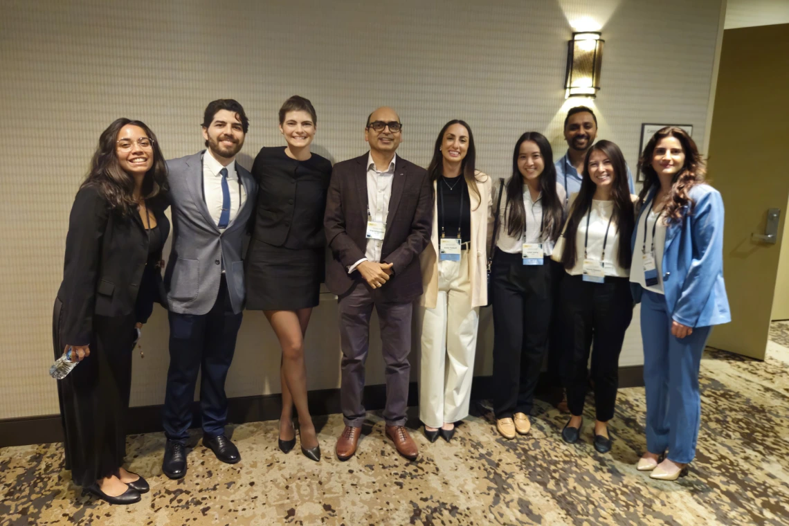 [Bujji Ainapurapu, MD, FACP (center), assistant professor, Inpatient Medicine division, and IM Residency Program – Tucson associate program director, with (from left) fourth-year medical student Gisselle Pegaitaz, and PGY2 IM residents: Eduardo Garcia Licerio, MD; Jessica Kitsen, DO; Emily Tishkoff, MD; Kellie Jeong, DO; Dwani Patel, MD, PhD; Tammy Zamaitis, DO, and Shenar Dinkha, DO.]