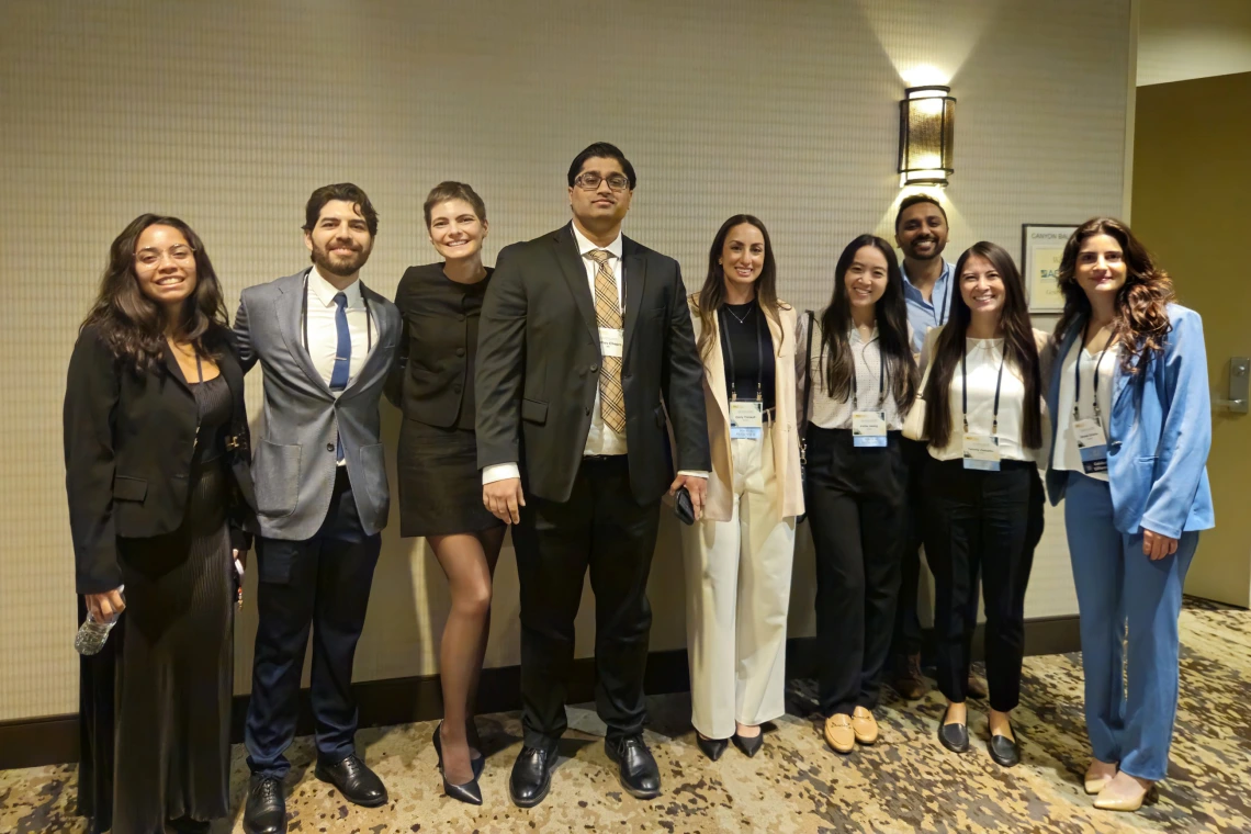 [A lecturer at the 2025 ACP Arizona Chapter Scientific Meeting, Madhav Chopra, MD (center), assistant professor, Pulmonary division, and Interventional Pulmonology Team member with (from left) fourth-year medical student Gisselle Pegaitaz, and PGY2 IM residents: Eduardo Garcia Licerio, MD; Jessica Kitsen, DO; Emily Tishkoff, MD; Kellie Jeong, DO; Dwani Patel, MD, PhD; Tammy Zamaitis, DO, and Shenar Dinkha, DO.]