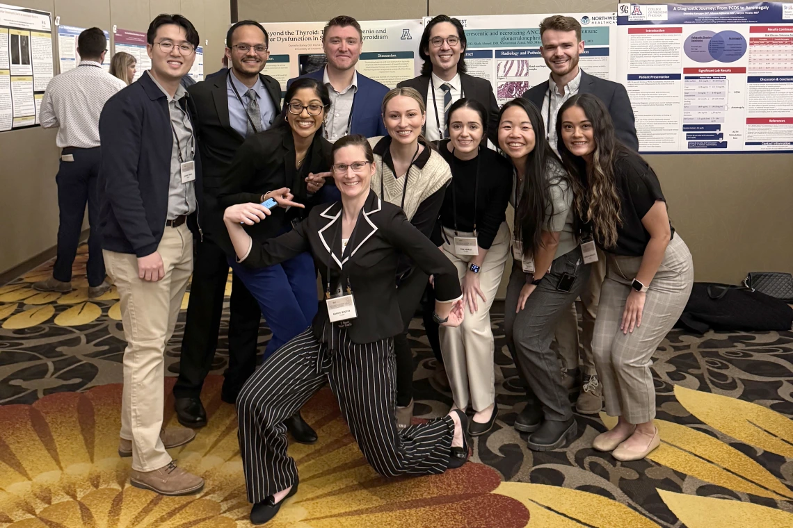 [Internal Medicine residents (PGY2s) with Chief Resident Kandis Boothe in front of ballroom at Casino del Sol Resort in Tucson.]