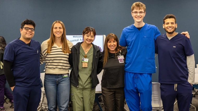 [IMSA members with their faculty advisor, Amy Sussman, MD (center), who’s also the DOM’s vice chair of education and IM Clerkship director. Others from left: David Effio Vizcarra, Lauren Heathcock, Yi-Jen Yang (IMSA co-president and CUP Shubitz Family Clinic coordinator), Caleb Seekins (IMSA co-president), and Saleh Mostafa, all first-year medical students at the College of Medicine – Tucson.]