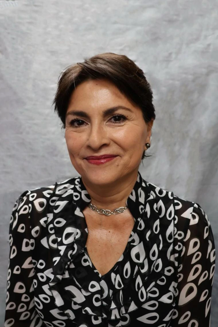 [Mary E. Bonarand - brunette woman in black and white patterned blouse]