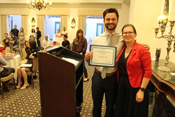 [Laura Meinke, MD, and IM resident Tyler Gloe, DO, winner of the Outstanding Humanism & Professionalism Award]