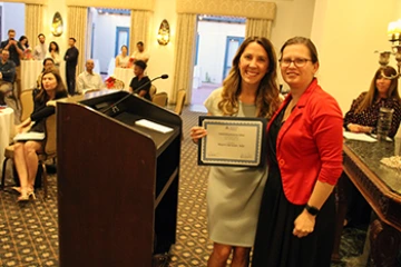 [Laura Meinke, MD, and Pulmonary & Critical Care fellow Marni Sarazen, MD, winner of the Outstanding Medicine Fellow Award]