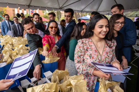Fourth-year medical students collect gift bags before learning where they will spend the next several years in residency training programs.